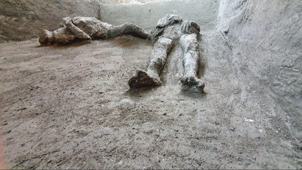 Two casts of victims remain in situ at Pompeii, where volcanic deposits preserved the impressions left by their bodies. (Photo via The Archaeological Park of Pompeii)