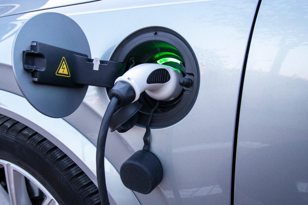 EV car or electric car at charging station with the power cable supply plugged in, accessed on Oct. 7, 2026. (Adobe Stock Photo)