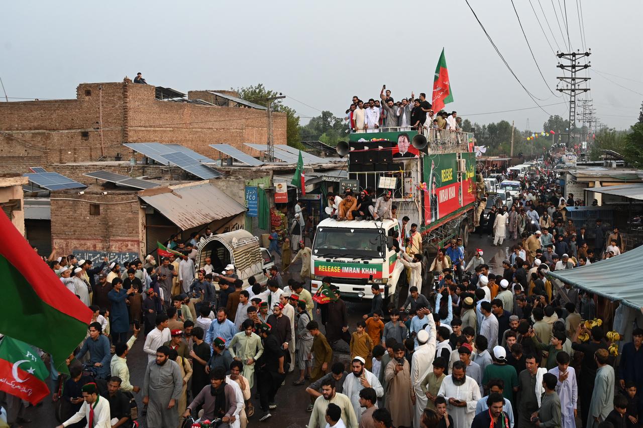 Supporters of jailed former prime minister Imran Khan's Pakistan Tehreek-e-Insaf (PTI) take part in a march in Khyber district of Pakistan's Khyber Pakhtunkhwa province on October 7, 2026. (AFP Photo)