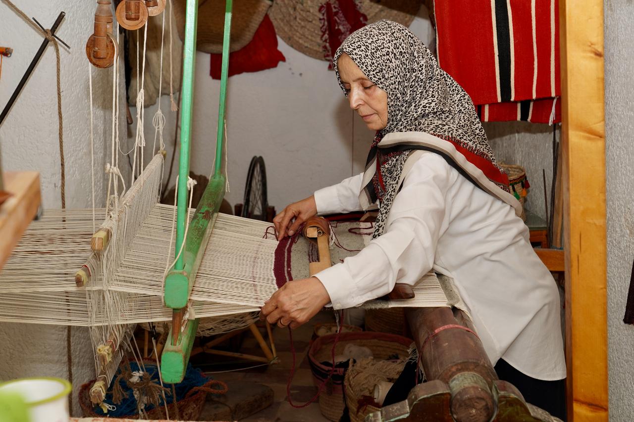 Ayse Madi works to revive the historic craft of traditional weaving using a century-old loom at their workshop in the Old City of Tripoli, Libya on October 06, 2026. (AA Photo)