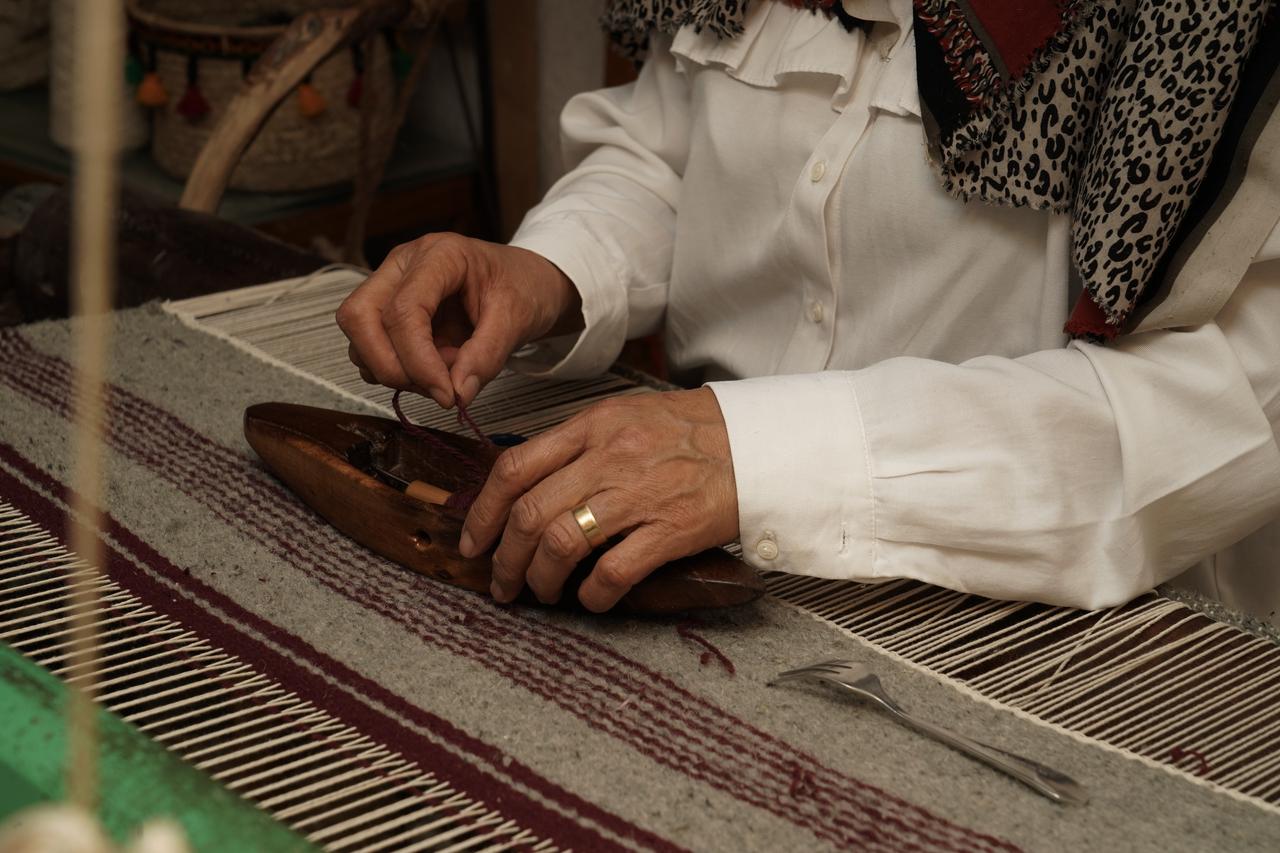 Libyan cousins Zeynep Madi and Ayse Madi work to revive the historic craft of traditional weaving using a century-old loom at their workshop in the Old City of Tripoli, Libya on October 06, 2026. (AA Photo)