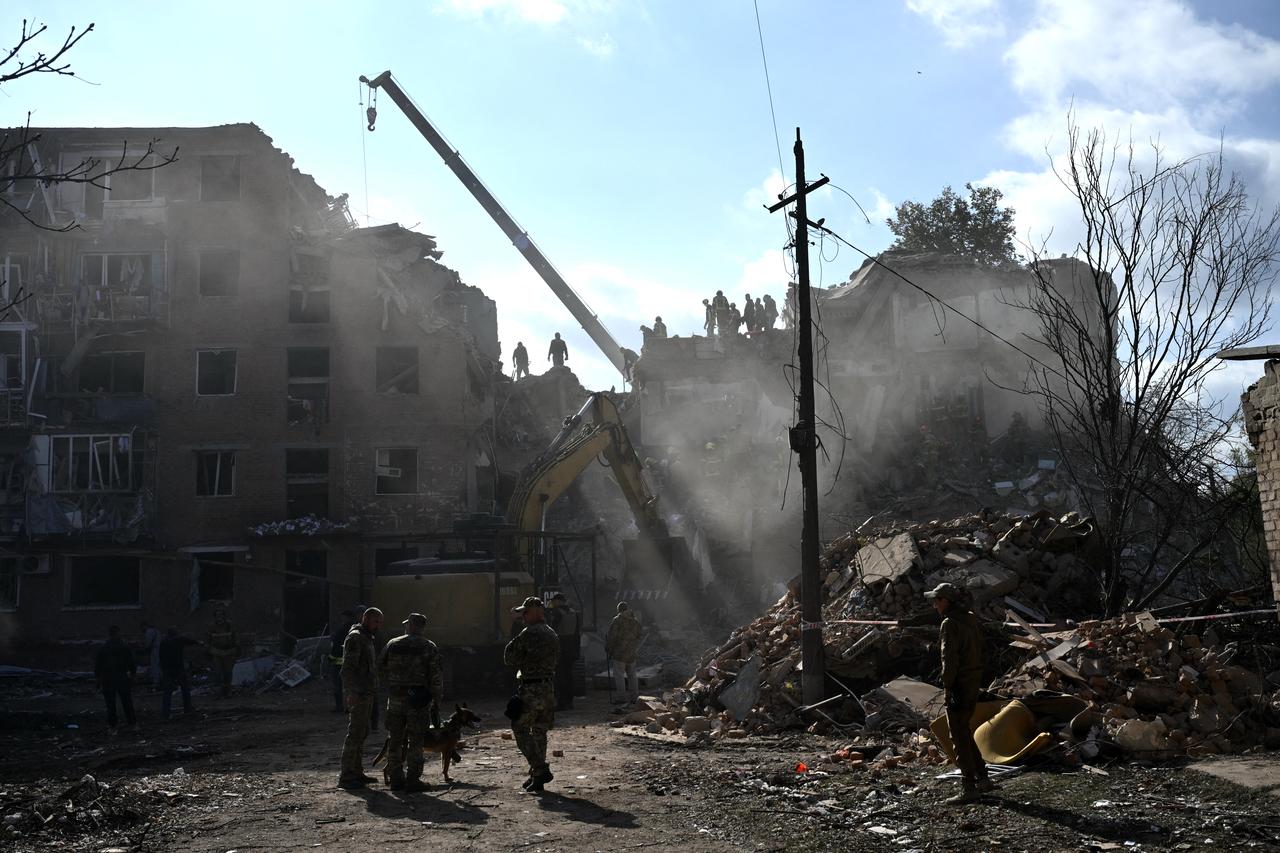 Rescuers conduct search and rescue operations at the site of a Russian aerial strike at a multi-floor residential building in Pryluky on October 7, 2026, amid Russian invasion of Ukraine. (AFP Photo)