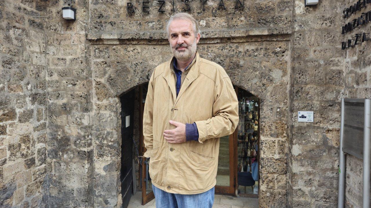Bosnian archaeologist Adnan Muftarevic, who has spent more than two decades researching and uncovering Ottoman-era heritage across Bosnia and the Balkans, poses in Sarajevo. (Photo via Türkiye Daily)
