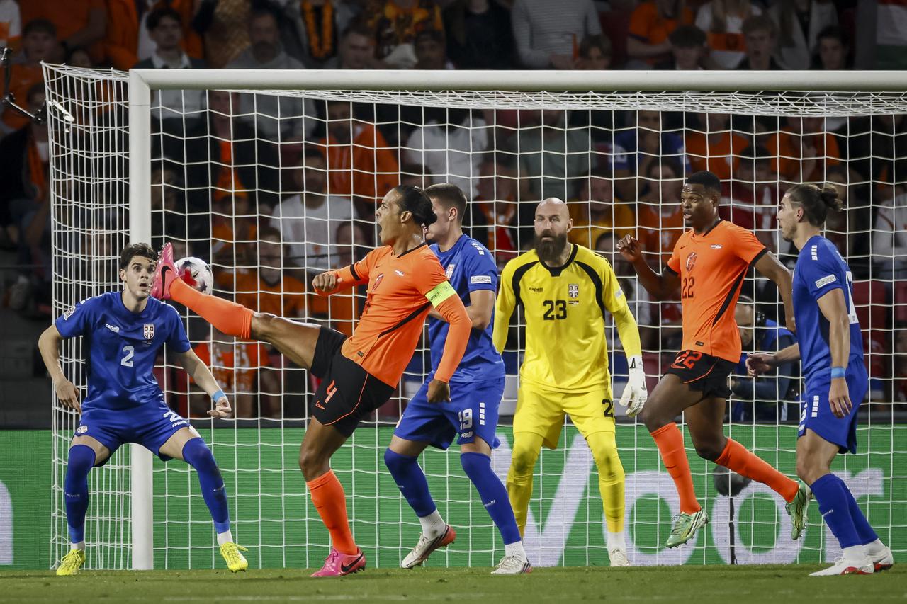 Netherlands' defender #04 Virgil van Dijk (2L) and Serbia's defender #19 Stefan Gudelj (3L) during the UEFA Nations League football Group A2 match between the Netherlands and Serbia at the Philips stadium in Eindhoven on October 4, 2026. (AFP Photo)
