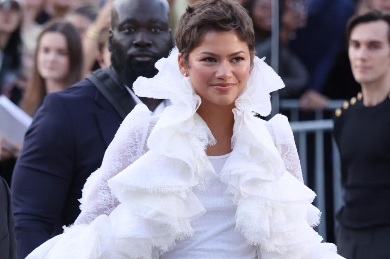 Zendaya stays seated for France's first lady at Paris show, drawing mixed reaction