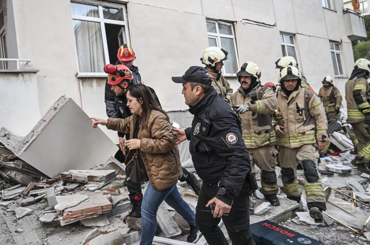 Search and rescue teams continue efforts to locate and rescue people trapped under the rubble as an injured person is taken to a hospital by ambulance after the lower floors of a seven-story building partially collapse in the Maltepe district of Istanbul, Türkiye, October 8, 2026. (AA Photo)