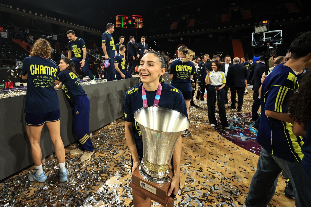 Fenerbahce Tarfin players celebrate receiving the trophy during a ceremony after defeating CIMSA CBK Mersin 79-71 to win the FIBA SuperCup Women 2026 title at Servet Tazegul Sports Hall in Mersin, Türkiye, on October 7, 2026. (AA Photo)