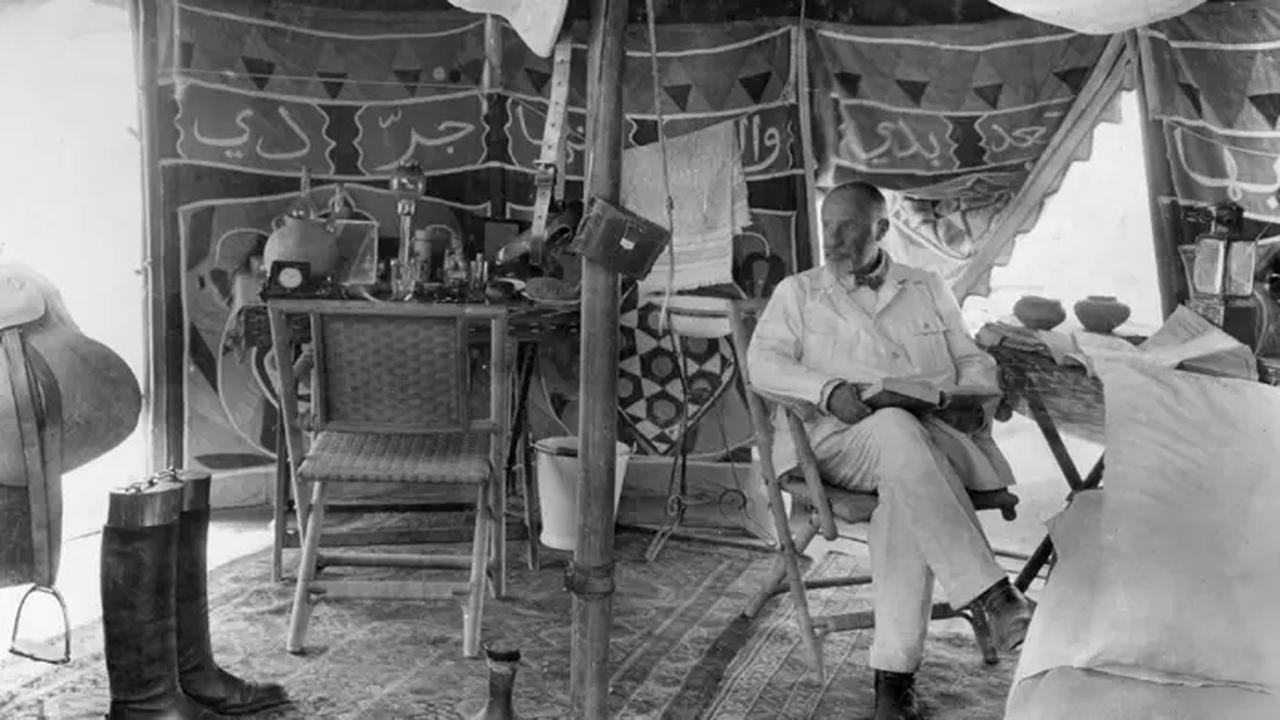 German archaeologist Max von Oppenheim sits inside his expedition tent in Syria in 1929, surrounded by travel equipment and furnishings. (Photo courtesy of the Max Freiherr von Oppenheim Foundation)