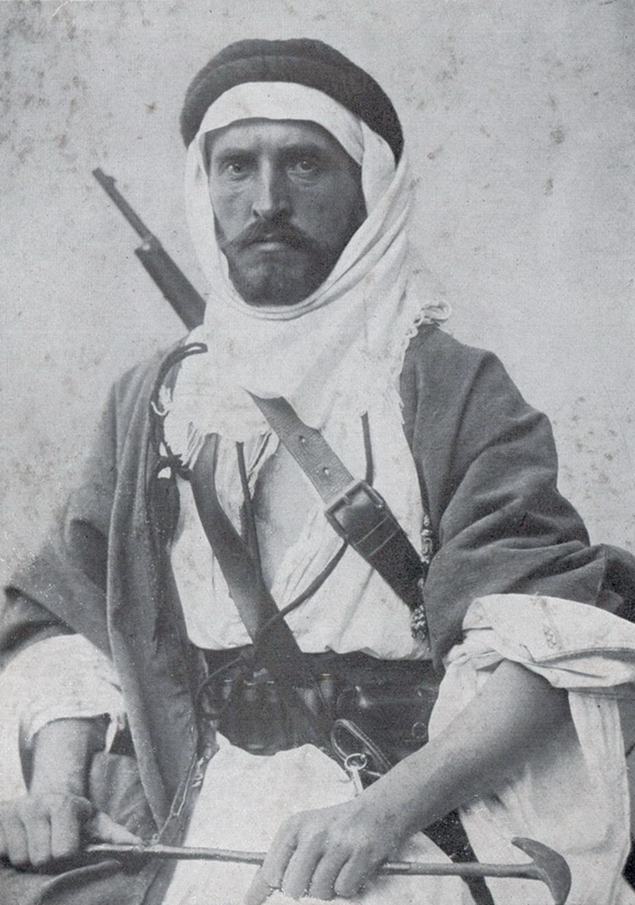 Austro-Hungarian orientalist and explorer Alois Musil, known among Arab communities as "Shaykh Musa," poses in traditional Arab clothing with a rifle in 1901. (Photo via Wikimedia)