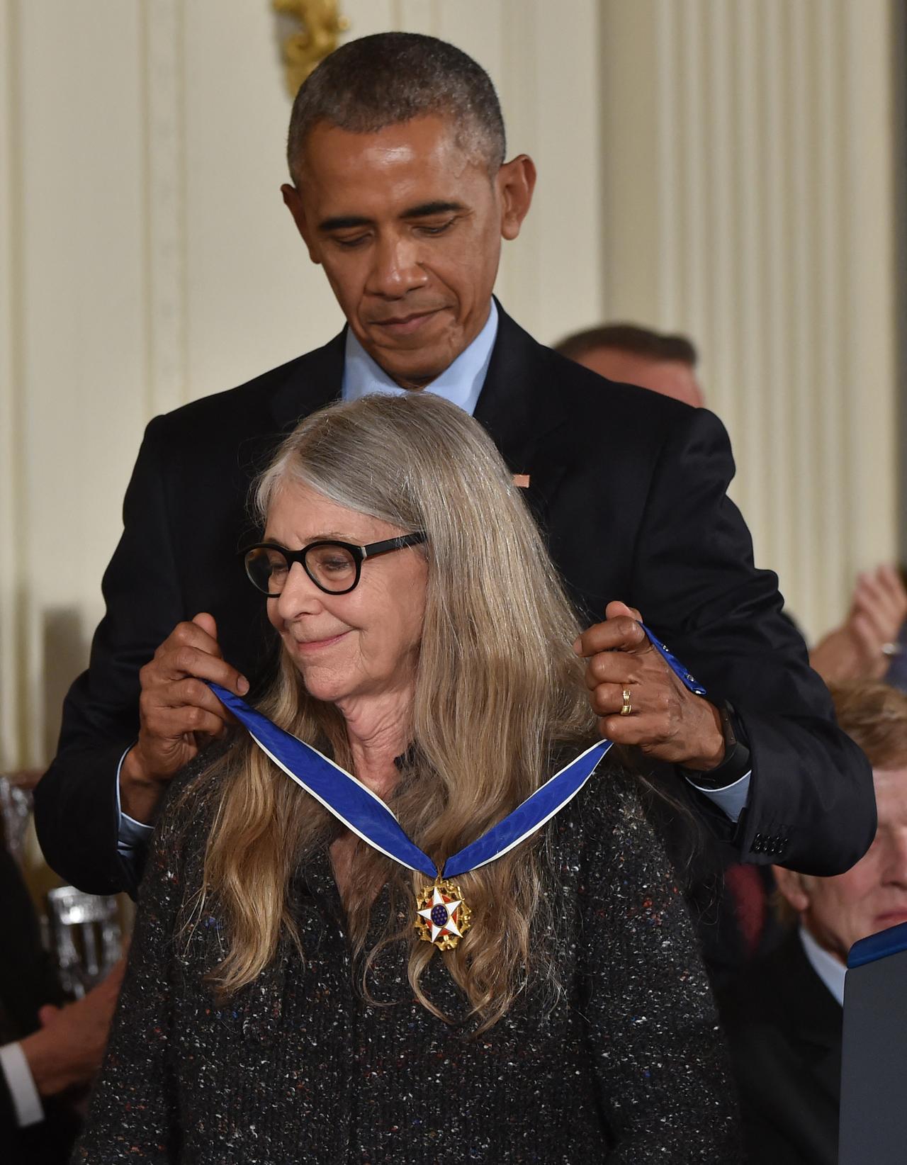 Former US President Barack Obama presents mathematician and computer scientist Margaret Hamilton with the Presidential Medal of Freedom, the nation's highest civilian honor, during a ceremony honoring 21 recipients, in the East Room of the White House in Washington, DC, November 22, 2016. (AFP Photo)