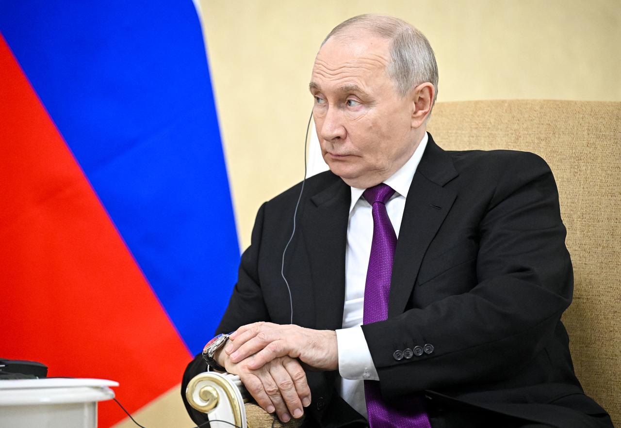 In this pool photograph distributed by the Russian state agency Sputnik, Russia's President Vladimir Putin attends a meeting with Iranian President in Turkmenbashi on Oct. 8, 2026. (AFP Photo)