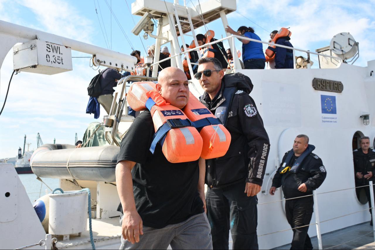 Crew members from a vessel struck by drones in Bulgaria's exclusive economic zone arrive at the port of Varna after being rescued on October 6, 2026. (AFP Photo)
