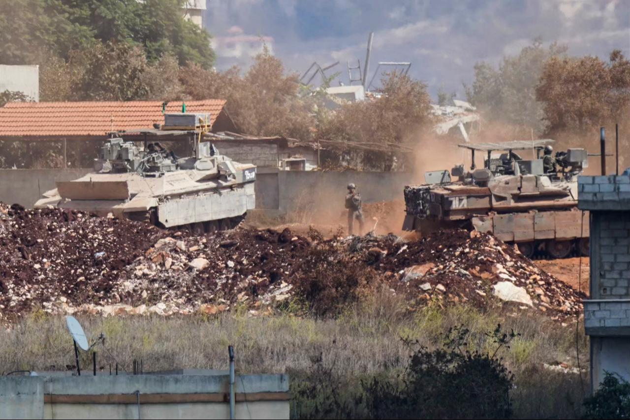A photograph taken from the southern Lebanese village of Zawtar al-Gharbiyah shows Israeli armored vehicles maneuvering in the nearby village of Zawtar al-Charkiyah, Sept. 24, 2026. (AFP Photo)