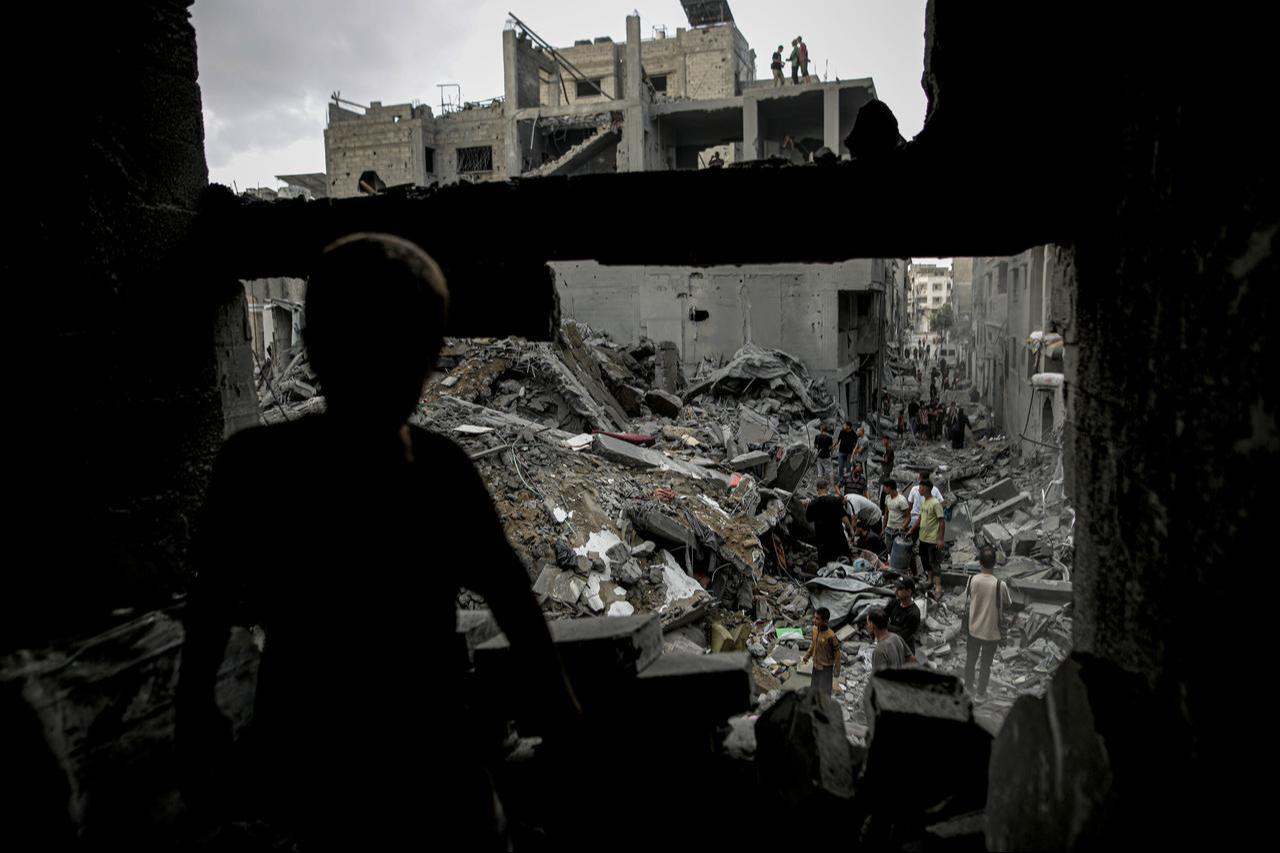 A general view of the destruction as Palestinian civilians and emergency responders search through the debris of damaged residential buildings following an Israeli military airstrike in the Sabra neighborhood, south of Gaza City, Palestine, Oct. 9, 2026. (AA Photo)