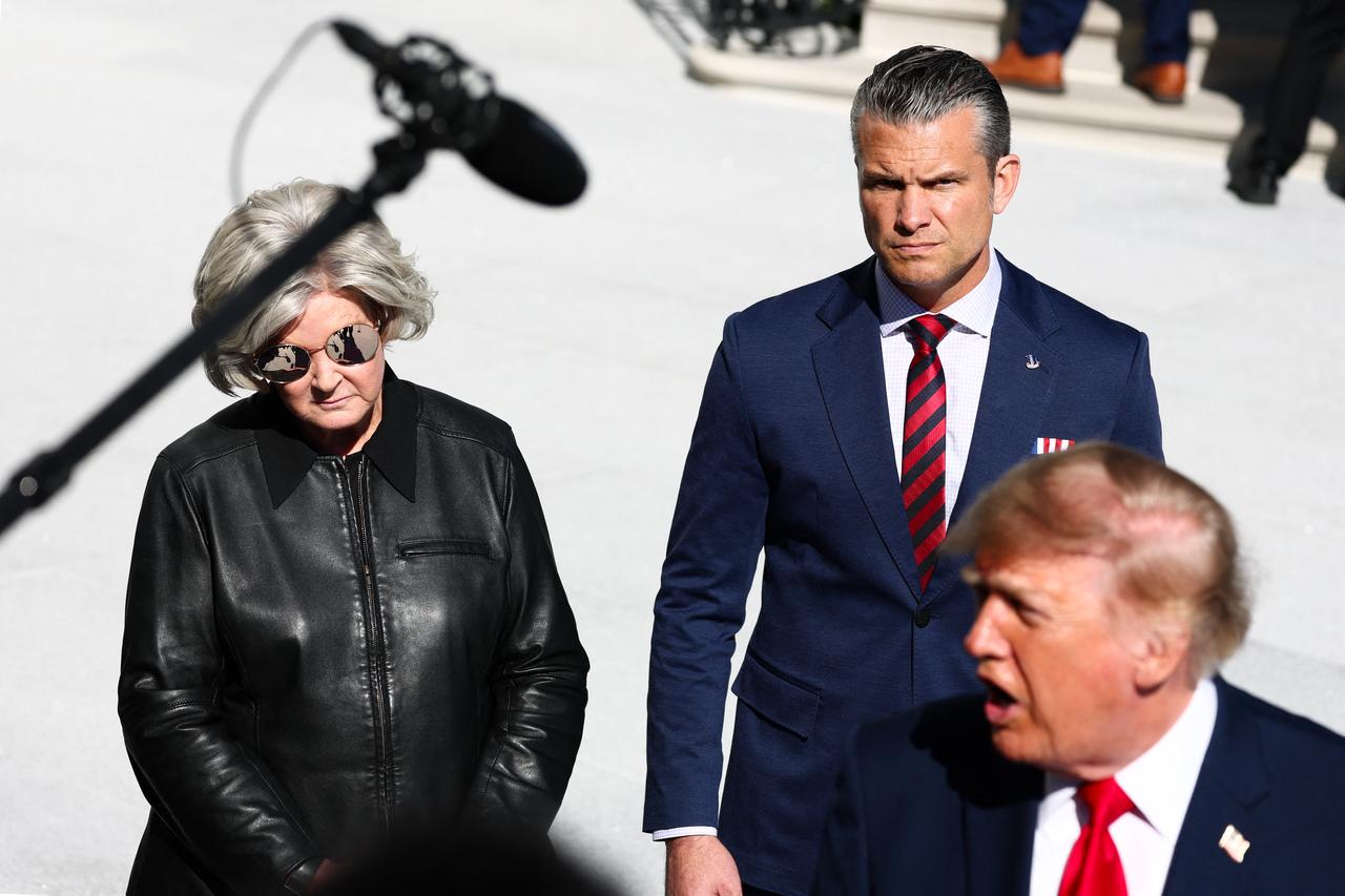 White House Chief of Staff Susie Wiles (L) and U.S. Secretary of War Pete Hegseth look on as U.S. President Donald Trump speaks to the news media as he departs on the South Lawn of the White House in Washington on October 06, 2026. (AFP Photo)