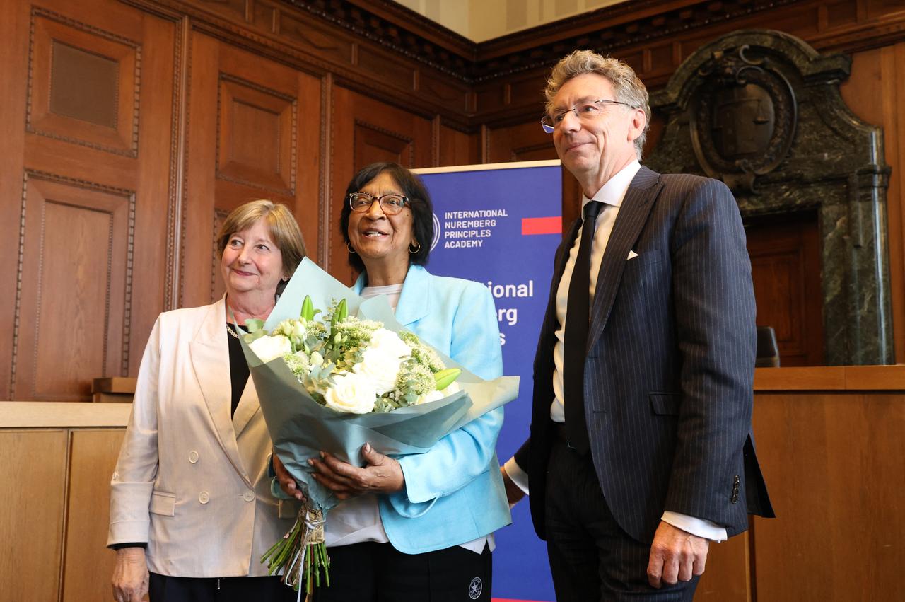 The 2026 Nobel Peace Prize laureate, South African lawyer and champion of international law Navi Pillay (C) poses with the former President of the International Criminal Court (ICC) Silvia Fernandez de Gurmendi (L) and the Director of the International Nuremberg Principles Academy Christoph Safferling (R) on October 9, 2026. (AFP Photo)