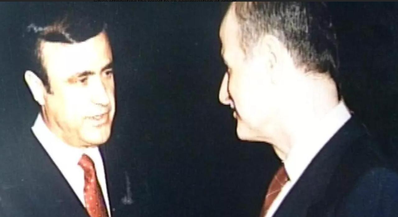 Former Syrian President Hafez al-Assad, with his youngest brother, Rifaat, attending a reception in London in 1986 (AFP Photo)
