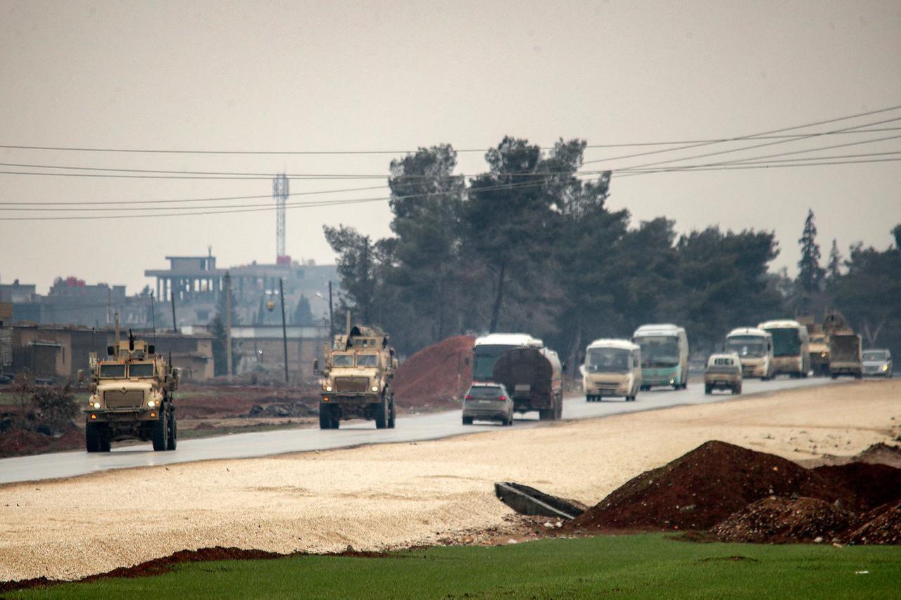 US military vehicles move along a road in a convoy transporting Islamic State group detainees being transferred to Iraq from Syria, on the outskirts of Qahtaniyah in Syria's northeastern Hasakah province, February 7, 2026. (AFP Photo)