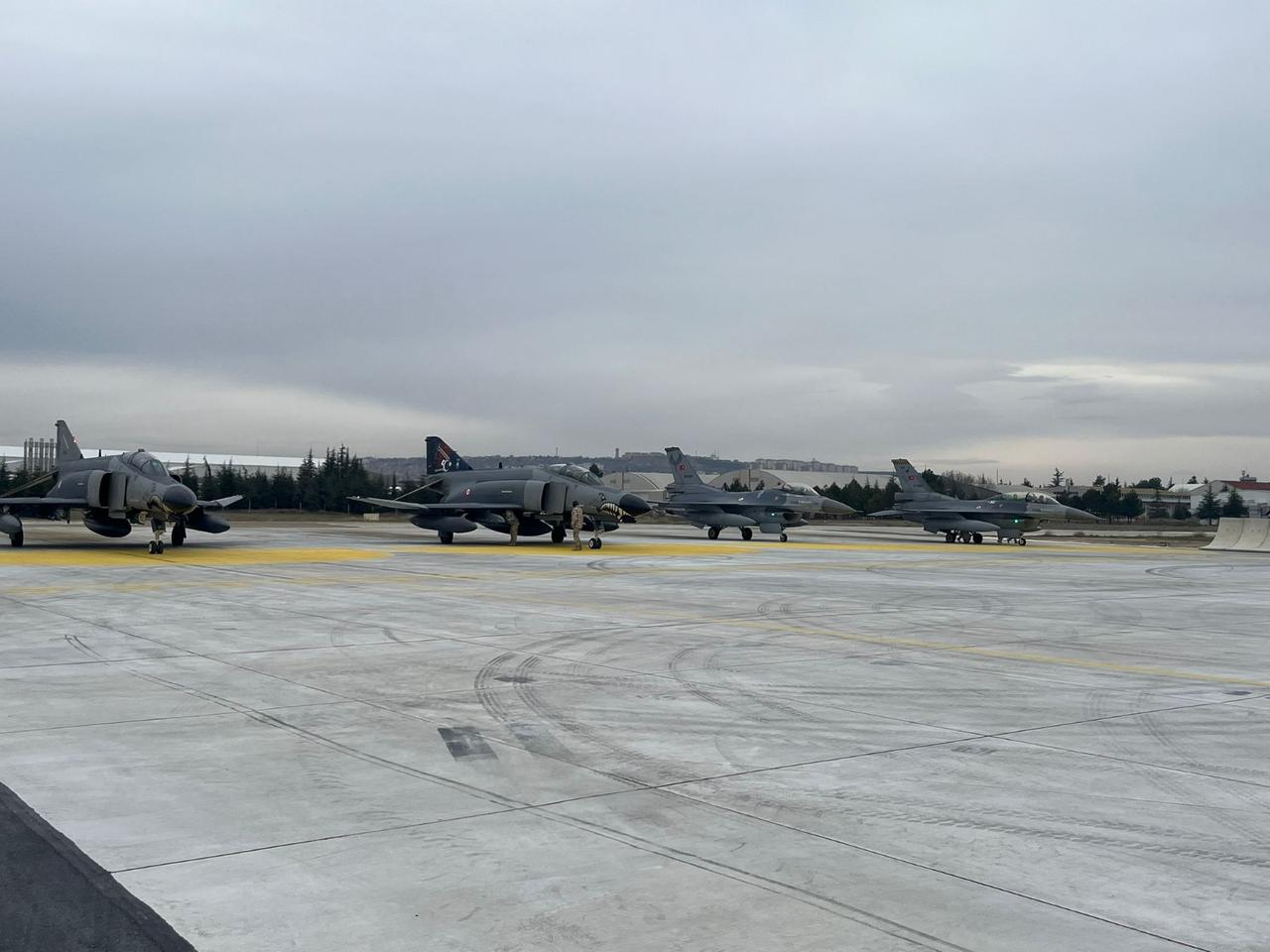 The Turkish Air Force Command's F-4E 2020 Terminator and F-16s on a runway at an unspecified location and time. (Photo via X/@tcsavunma)
