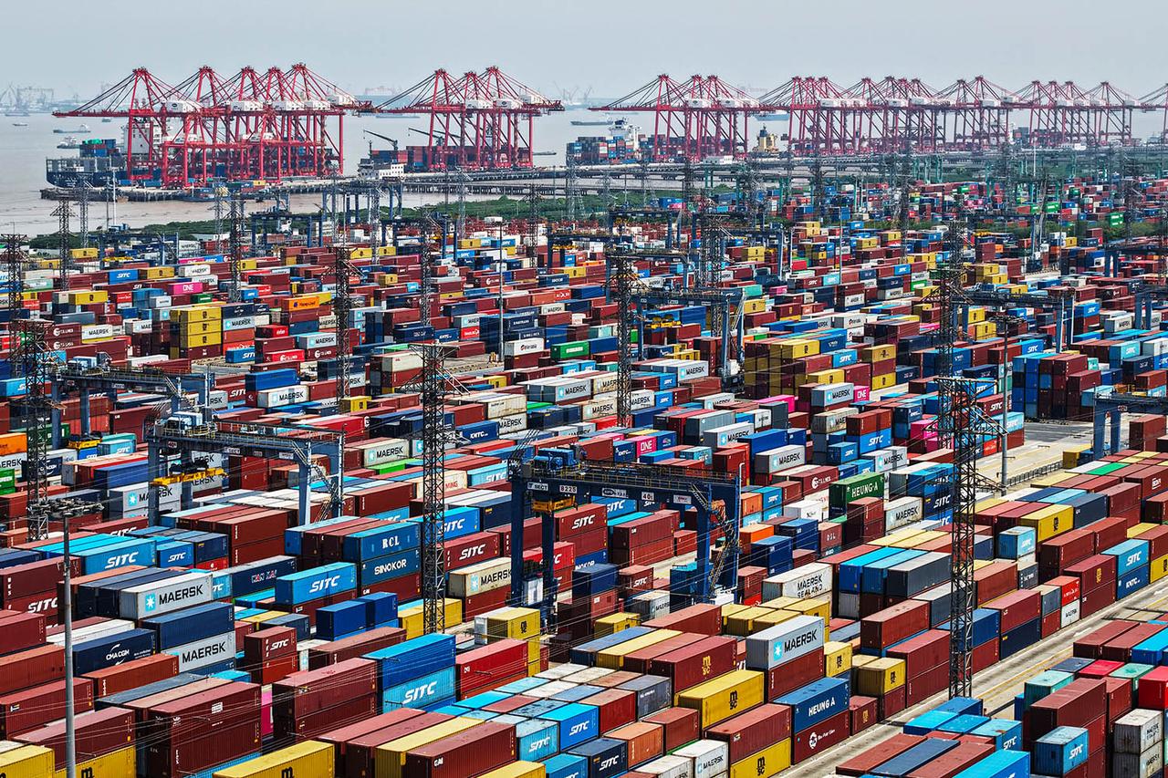 An aerial view shows cargo containers stacked at a port in Shanghai on April 20, 2025. (AFP Photo)