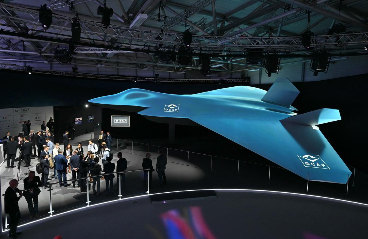 Delegates look at the Global Combat Air Programme (GCAP) 6th generation fighter jet concept design at Farnborough International Airshow 2024, London, July 22, 2024. (AFP Photo)