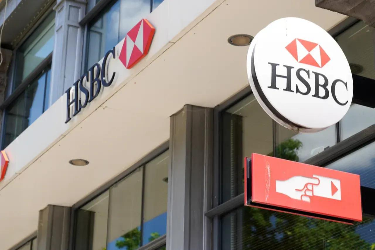 HSBC atm sign with the logo of the swiss bank agency brand in city street in Switzerland, accessed on Feb. 11, 2026. (Adobe Stock Photo)