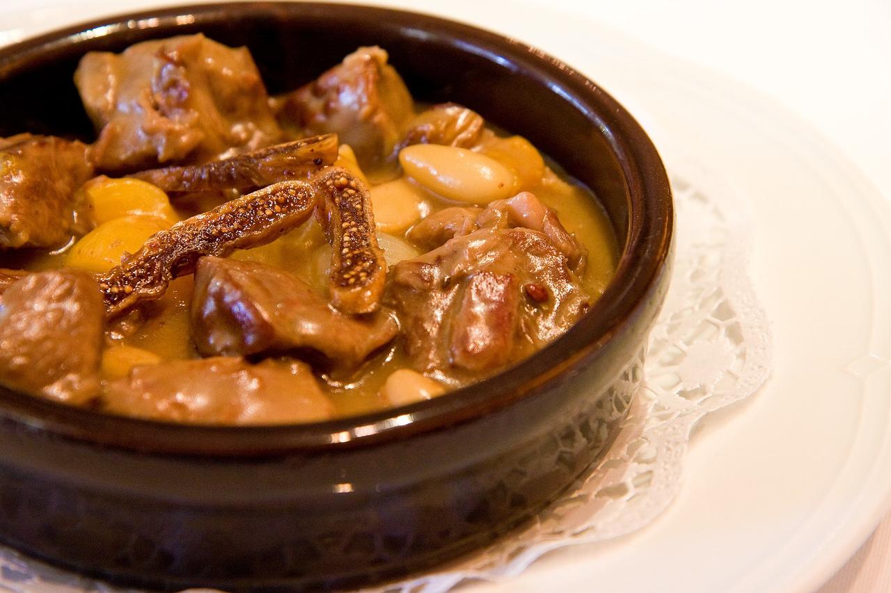 Mutancana served in a glazed earthenware bowl, tender lamb simmered with dried figs, apricots, almonds and honey in a glossy, thickened broth, accessed on Feb. 11, 2026. (Adobe Stock Photo)