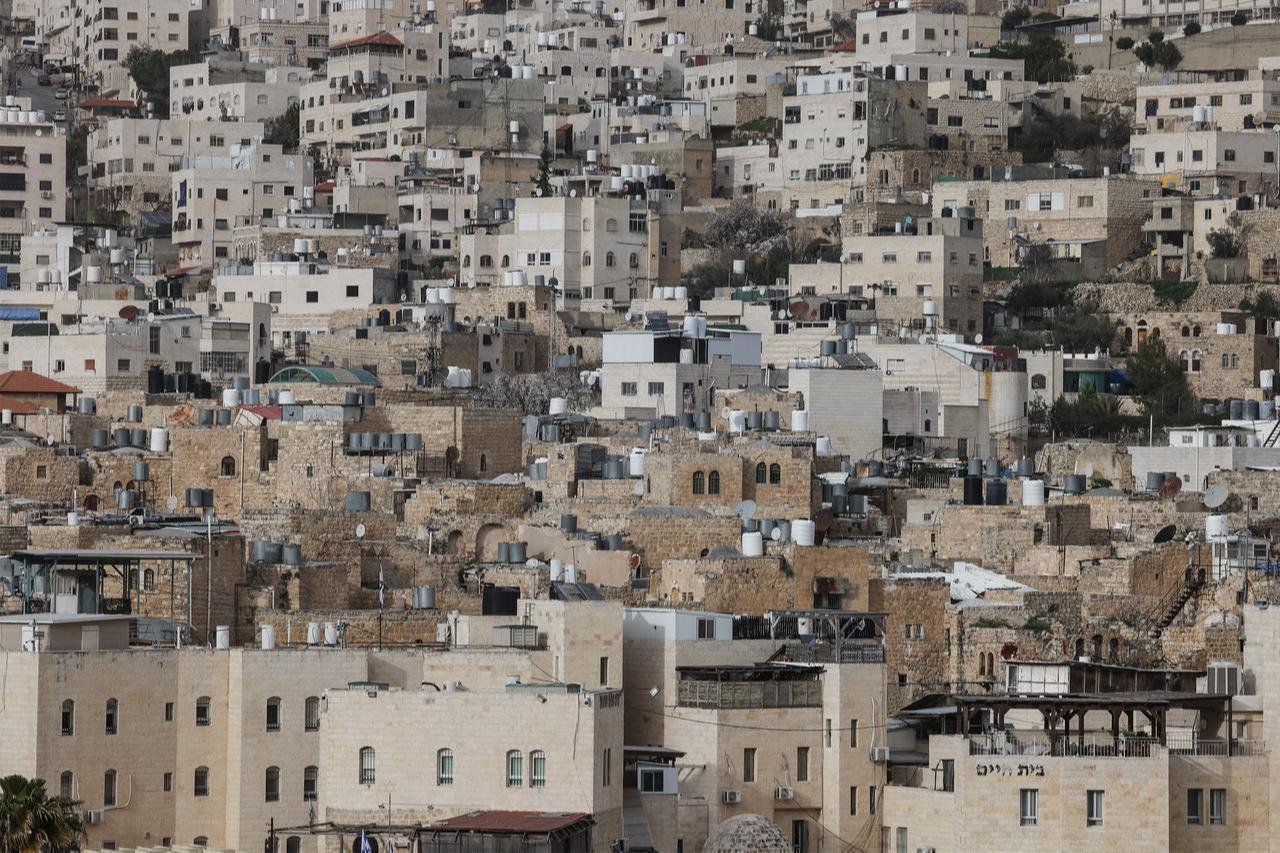 This picture shows the Israeli settlement of Abraham Avino (bottom) surrounded by Palestinian homes in the Israeli-occupied West Bank city of Hebron, Feb. 9, 2026. (AFP Photo)
