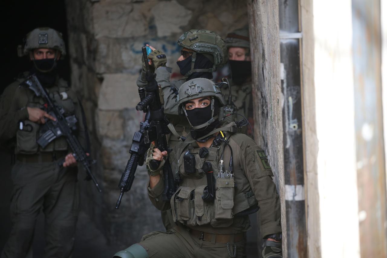 Israeli military forces take security measures around the area during a raid on the Old City, Nablus, West Bank, on February 11, 2026. (AA Photo)