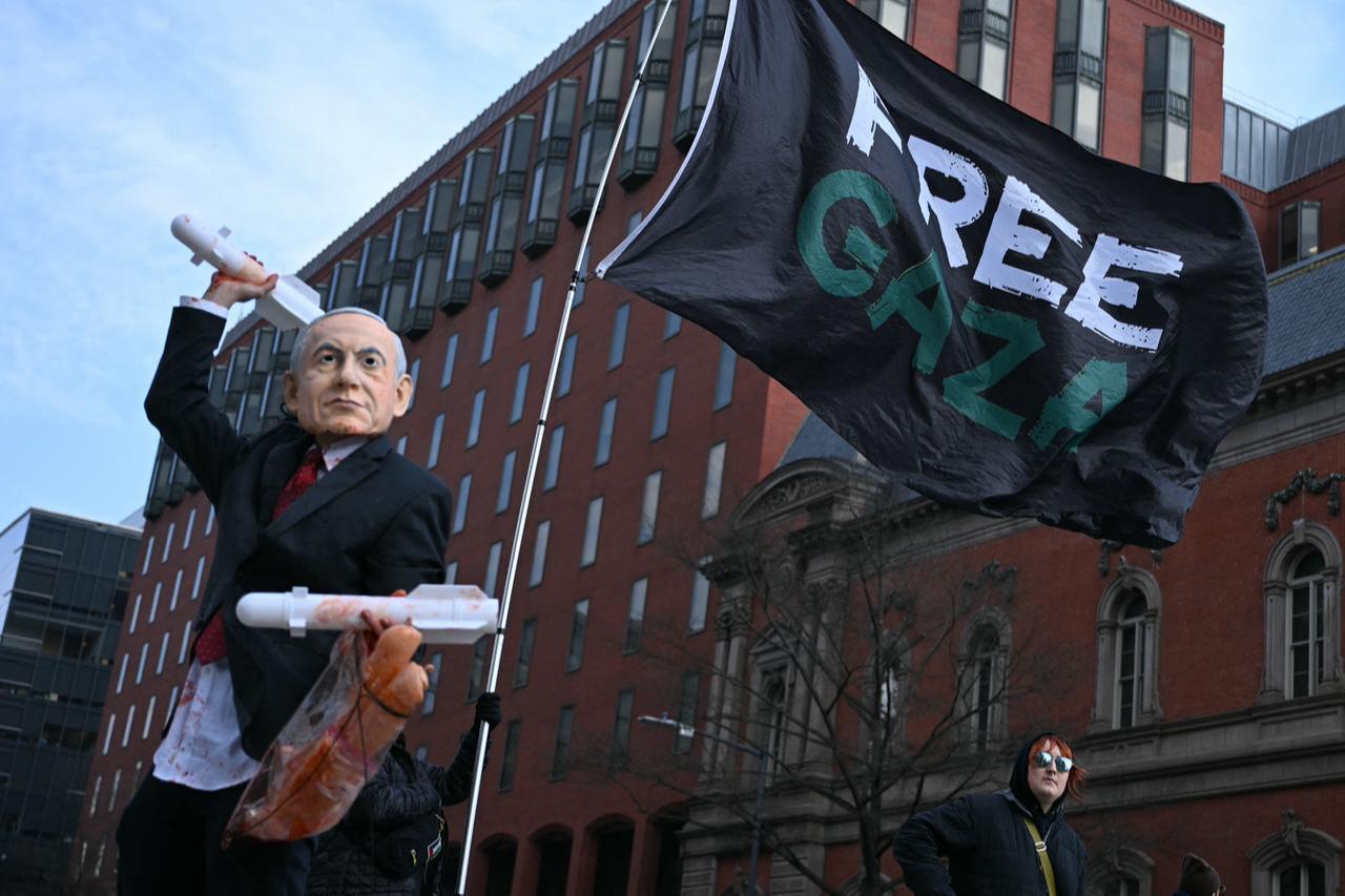 A person wearing a mask impersonating Israel Prime Minister Benjamin Netanyahu protest near the White House against the visit to the US of Netanyahu in Washington, DC, on Feb. 11, 2026. (AFP Photo)