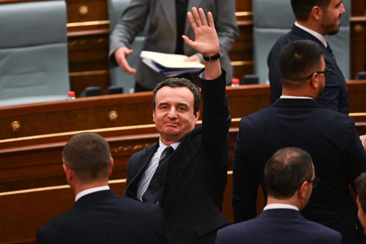 Newly-elected Prime Minister of Kosovo Albin Kurti (C) waves after a session in the parliament to form the new government, ending the country-s long-running political deadlock, in Pristina on Feb. 11, 2026. (AFP Photo)