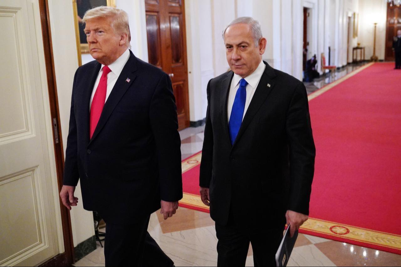 US President Donald Trump and Israeli Prime Minister Benjamin Netanyahu walk together in the East Room of the White House in Washington, DC, on Jan. 28, 2020. (AFP Photo)