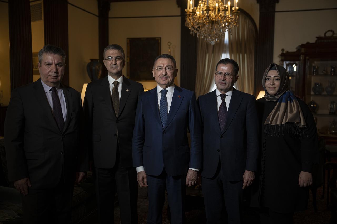 Fuat Oktay, Chairman of the Turkish Parliament's Foreign Affairs Committee, poses for a commemorative photo with his delegation and Ambassador Sedat Onal at the Turkish Embassy Residence in Washington, D.C., following a press briefing during their official visit to the United States. (AA Photo)