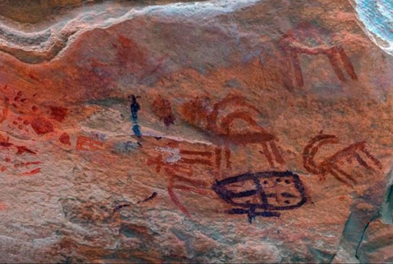 Multicolored prehistoric drawings painted on rock inside a shelter at the Umm Irak Plateau, South Sinai, Egypt, Feb. 12, 2026. (Photo via X/ @TourismandAntiq)
