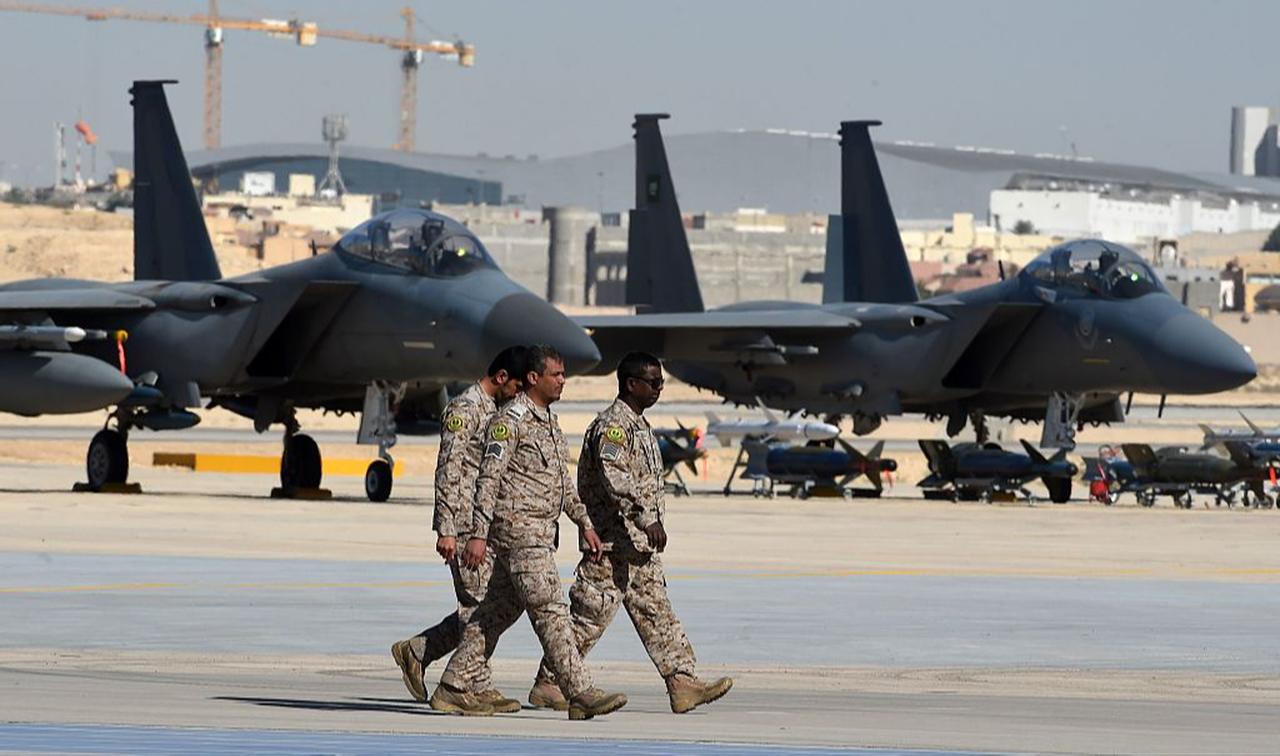 Saudi army officers walk past F-15 fighter jets during a ceremony marking the 50th anniversary of the creation of the King Faisal Air Academy at King Salman airbase in Riyadh, Jan. 25, 2017. (AFP Photo)