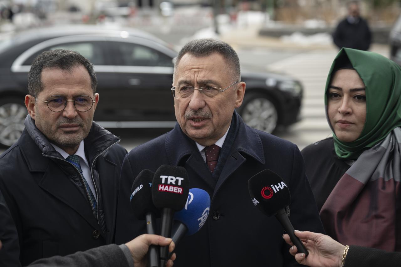 Turkish Parliament Foreign Affairs Committee Chairman Fuat Oktay (C) speaking to Turkish journalists in Washington DC. US, Feb. 13, 2026. (AA Photo)