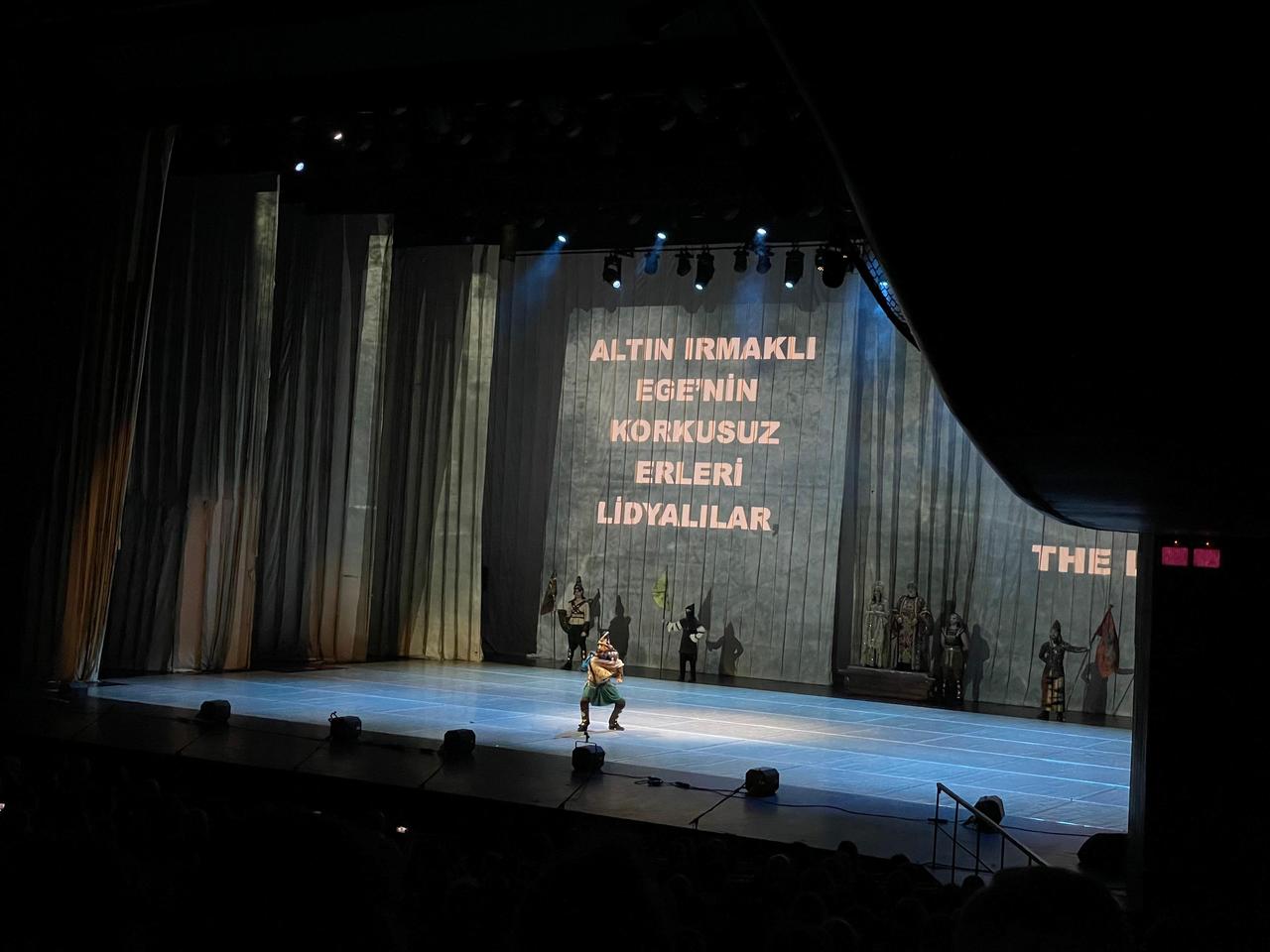 A performer represents Anatolian allies of Troy as projected narration references the Lydians during Fire of Anatolia’s “Troy” production at Ataturk Cultural Center in Istanbul, Türkiye, Feb. 10, 2026. (Photo by Koray Erdogan/Türkiye Today)