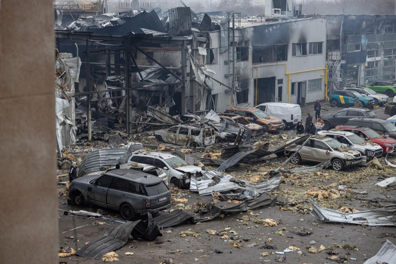 Local residents inspect damaged cars at the site of a Russian attack in Odesa on February 13, 2026, amid the Russian invasion of Ukraine. (AFP Photo)