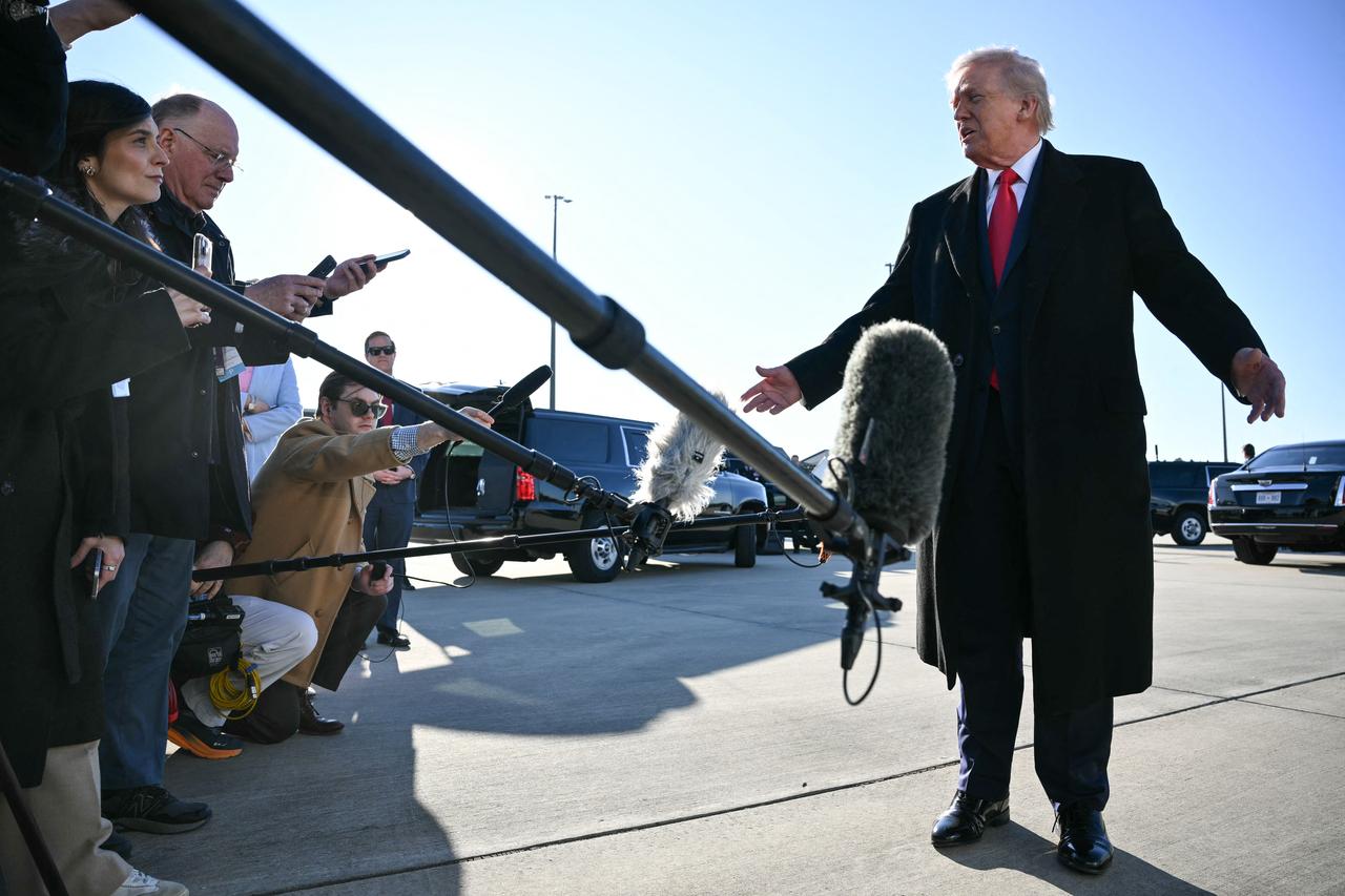 US President Donald Trump speaks to the press before boarding Air Force One at Pope Army Airfield at Fort Bragg, North Carolina, February 13, 2026. (AFP Photo)