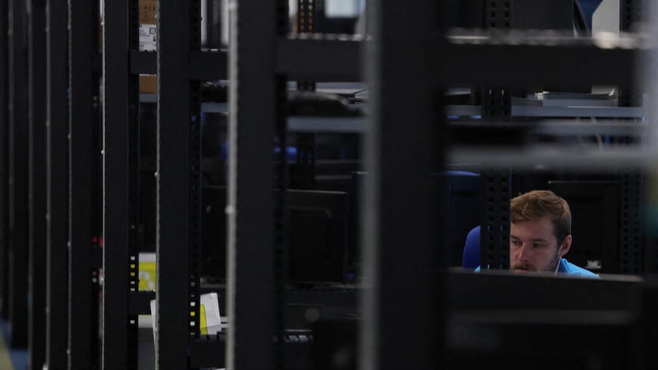An employee of the European multinational information technology service and consulting company, Atos, is pictured at the company's cybersecurity centre in Madrid, April 24, 2023. (AFP Photo)