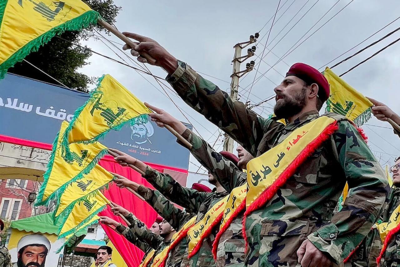 Hezbollah members parade during a ceremony to commemorate the partys killed leaders in the Lebanese village of Jibshit, on February 15, 2024. (AFP Photo)