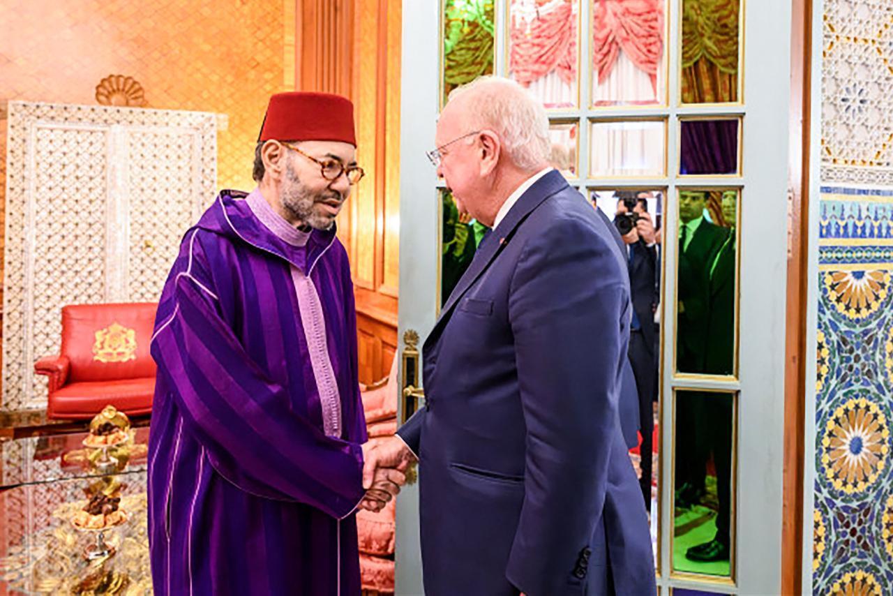 Morocco's  King Mohammed VI (L) shakes hands with the Chairman of Safran Ross McInnes, at the Royal Palace in Casablanca on February 13, 2026. (AFP Photo)