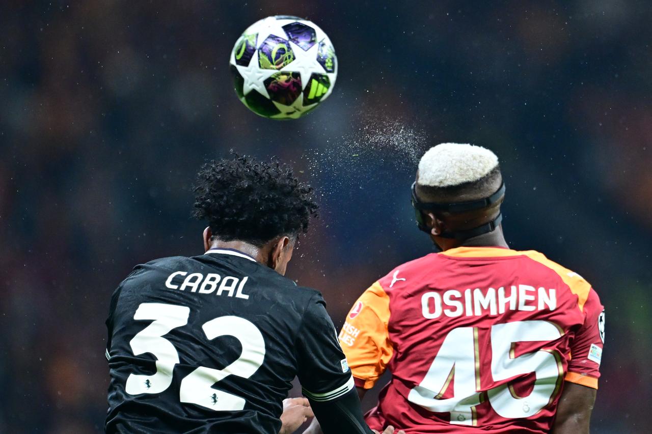 Victor Osimhen (45) of Galatasaray in action against Juan Cabal (32) of Juventus during the UEFA Champions League round of 16 play-off first-leg match between Juventus and Galatasaray at RAMS Park stadium in Istanbul, Türkiye on Feb. 17, 2026. (AA Photo)