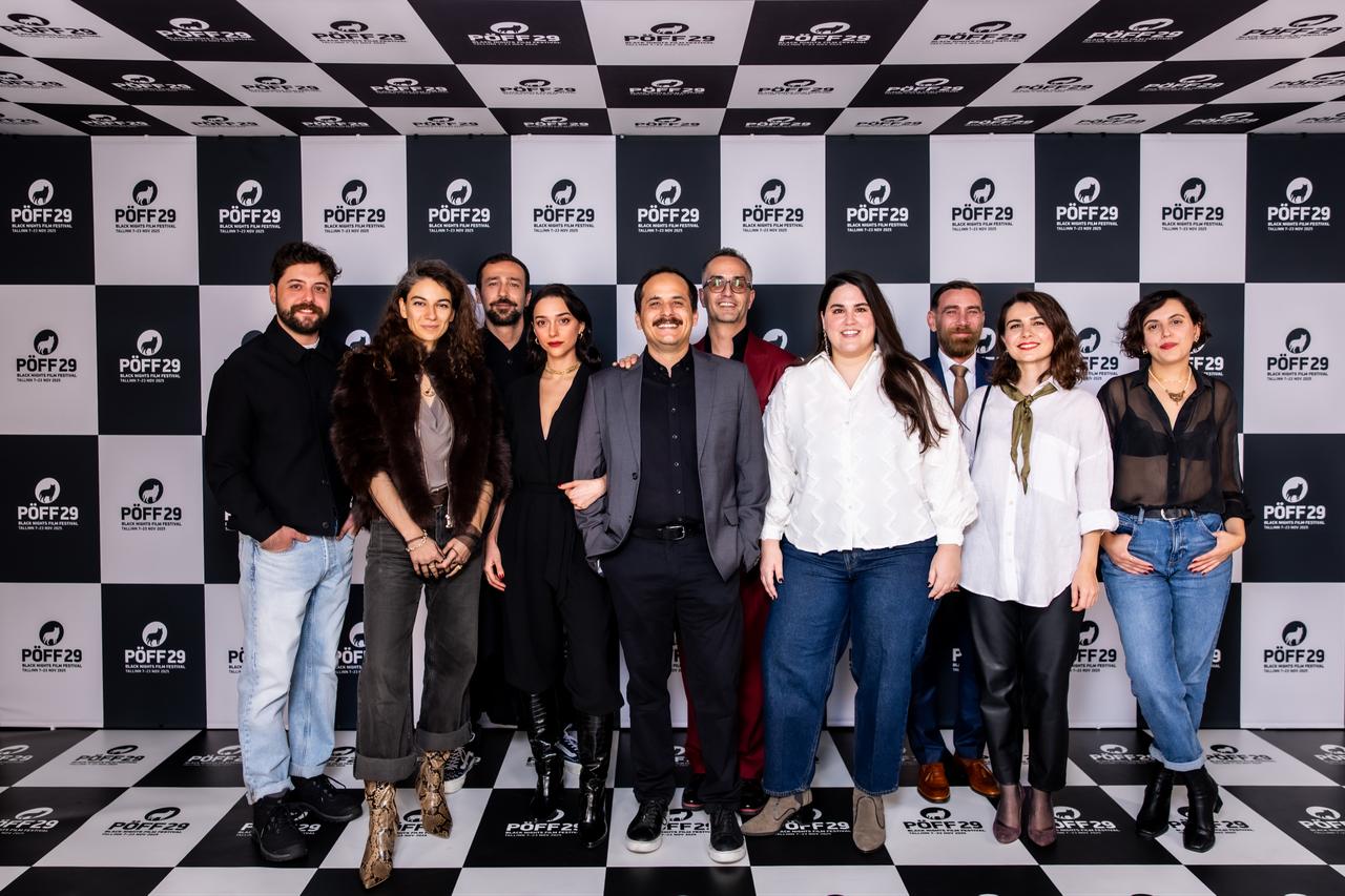 The cast and crew pose at the entrance during the Tallinn Black Nights Film Festival screening of The Dump of Untitled Pieces. (Photo via Dump of Untitled Pieces production companies)