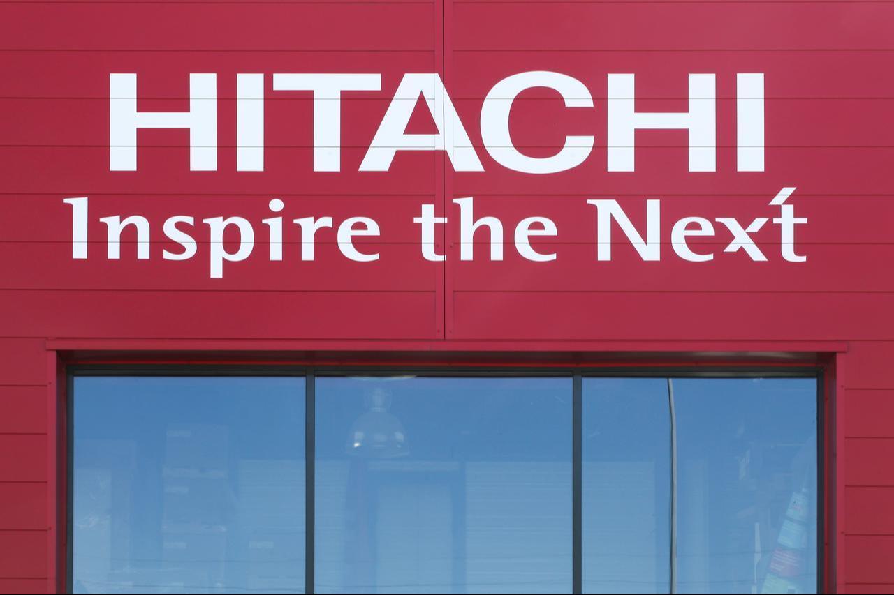 Hitachis logo and slogan displayed on the exterior of a company building in Saint Etienne, France, June 21, 2020. (Adobe Stock Photo)