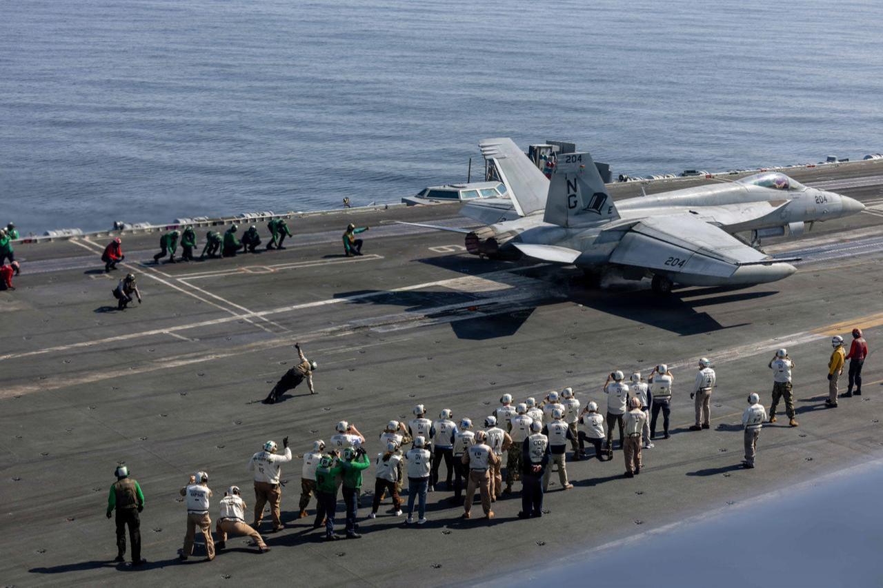 Observers watch flight operations on the flight deck of Nimitz-class aircraft carrier USS Abraham Lincoln (CVN 72) in the Arabian Sea, Feb. 7, 2026 (Photo by Hannah Tross/US Navy/AFP)