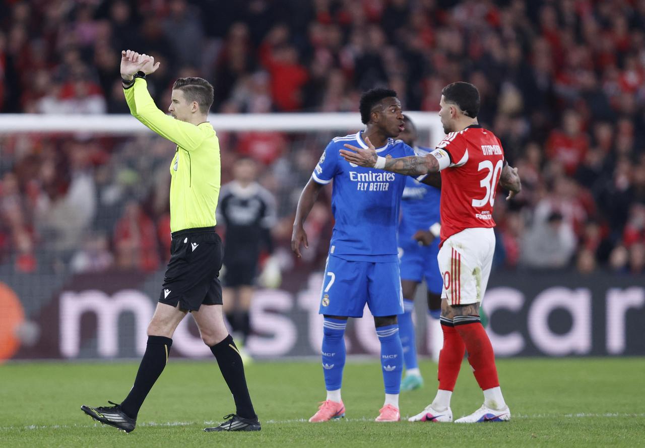 French referee Francois Letexier stops the game after Real Madrid's Brazilian forward #07 Vinicius Junior listened racists insults during the UEFA Champions League knockout round play-off first leg football match between SL Benfica and Real Madrid CF at Estadio da Luz in Lisbon on Feb. 17, 2026. (AFP Photo)