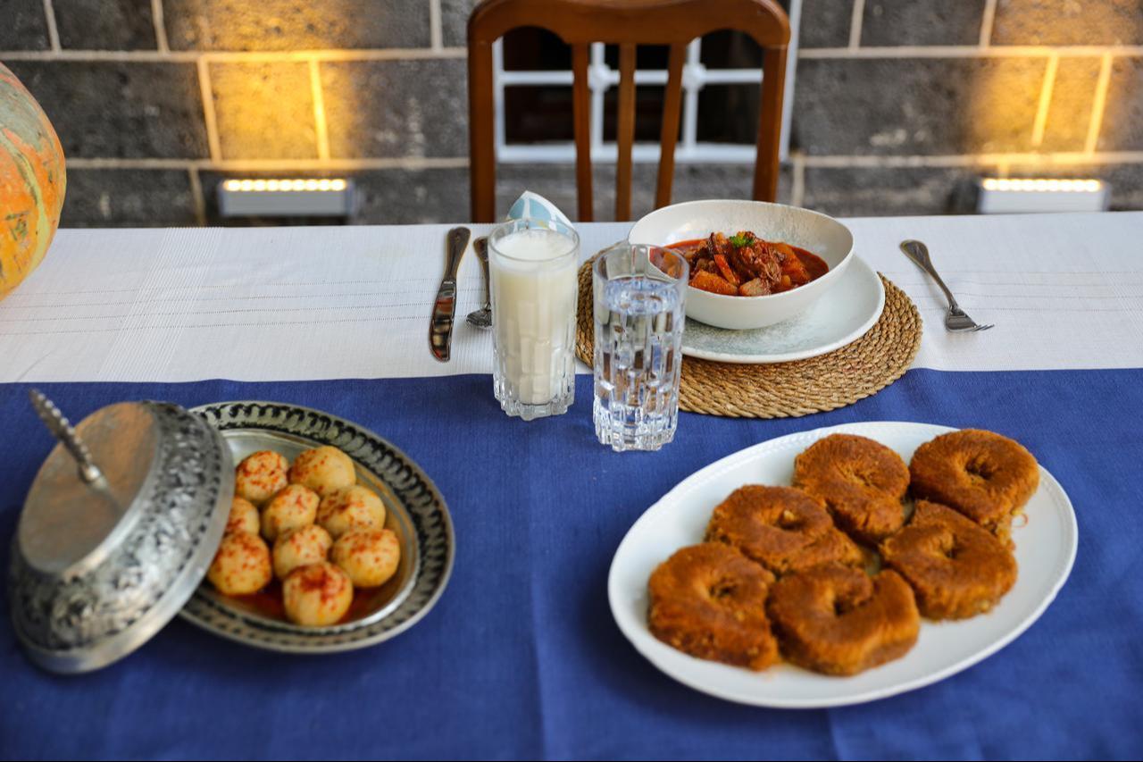 Traditional dishes, including kabak meftunesi, are served on a local dining table showcasing Diyarbakir’s regional culinary heritage in Türkiye, Feb. 19, 2026. (AA Photo)