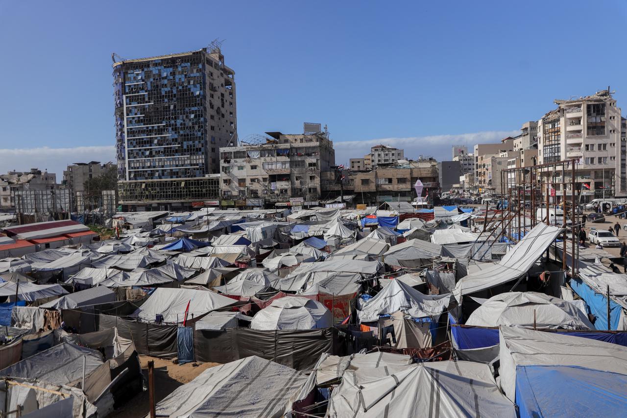 Palestinians continue their daily lives under harsh conditions amid the rubble left by Israeli attacks on February 19, 2026 in Gaza Strip. (AA Photo)