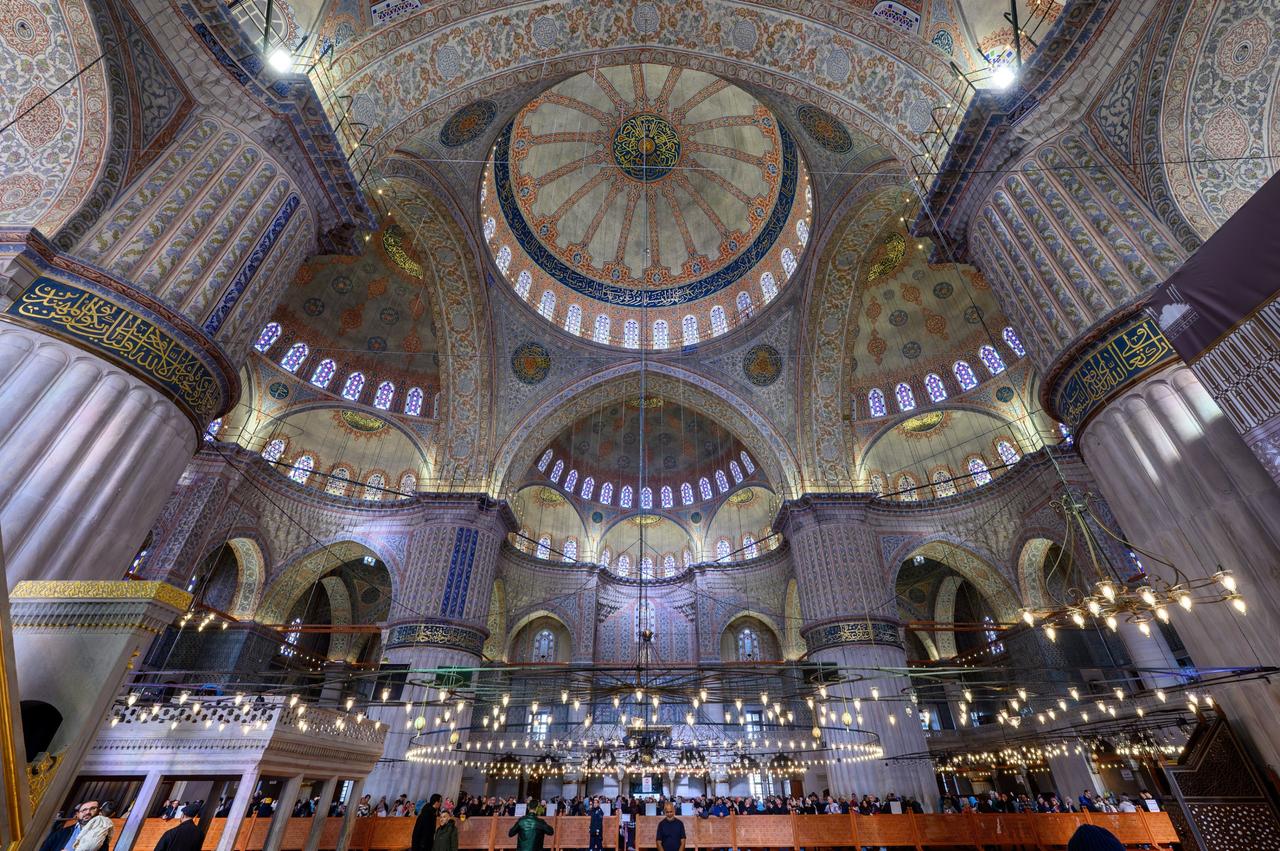 The decorated ceiling and central dome of the Sultanahmet Mosque interior are seen above the prayer hall, Istanbul, Türkiye, Feb. 13, 2026. (AA Photo)
